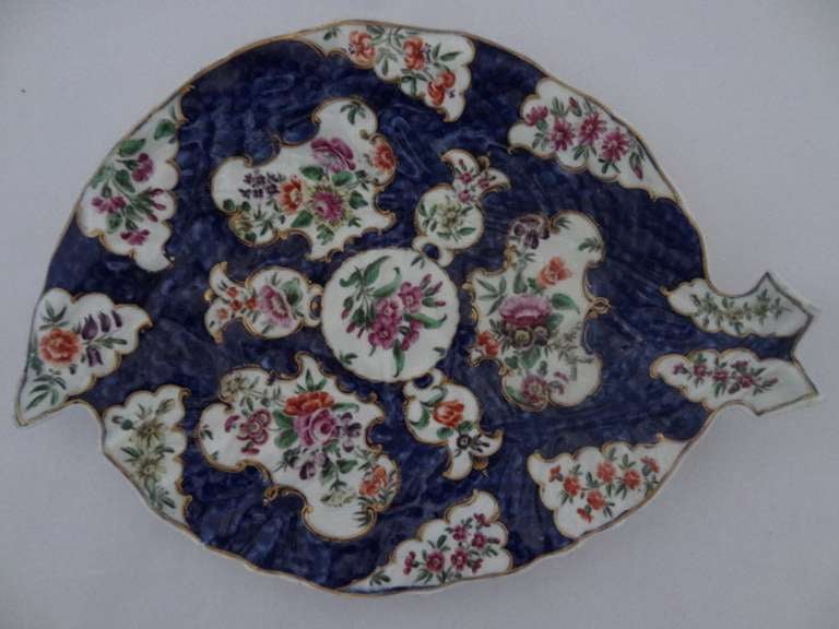 A polychrome Worcester first period leaf-shaped dish. The decoration is the characteristic floral cartouches on a cobalt blue ground. The Seal mark. 

Signed/Inscribed/Dated: Worcester First Period Seal Mark  

WORCESTER PORCELAIN (founded 1751)