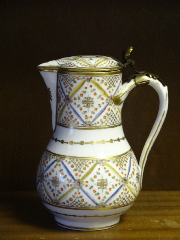 Porcelain Baluster Ewer by Andre-Marie Leboeuf of the Rue Thiroux Manufactory where he was potter to Queen Marie-Antoinette. 

The decoration is of floral bands with ribbons and the gilt lattice borders and finished with fine gilding.