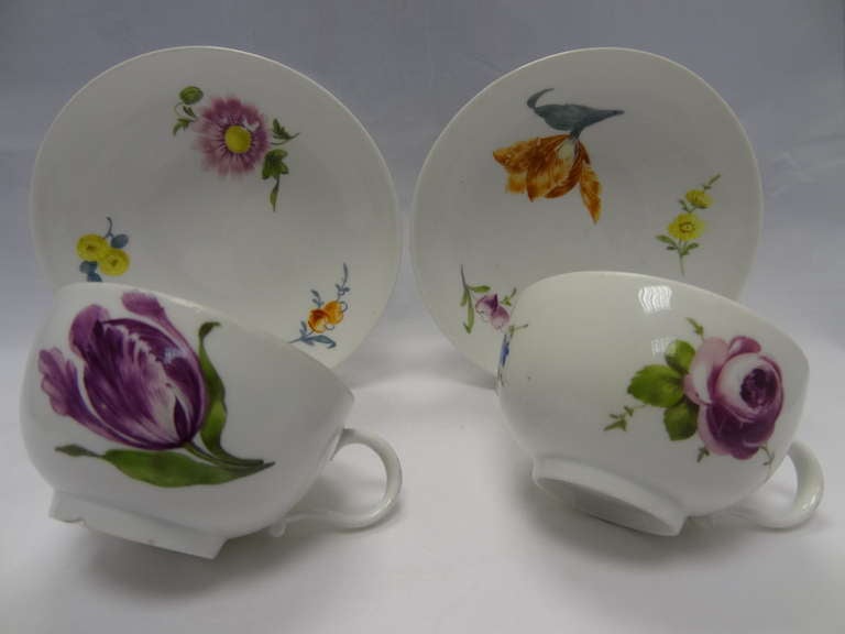 Pair Meissen Breakfast Cups and Saucers marked for the period under which Marcolini was directing operations at the Meissen manufactory. The free hand elegant flower illustrations and the hand-potting of the cups and saucers make tjese individual