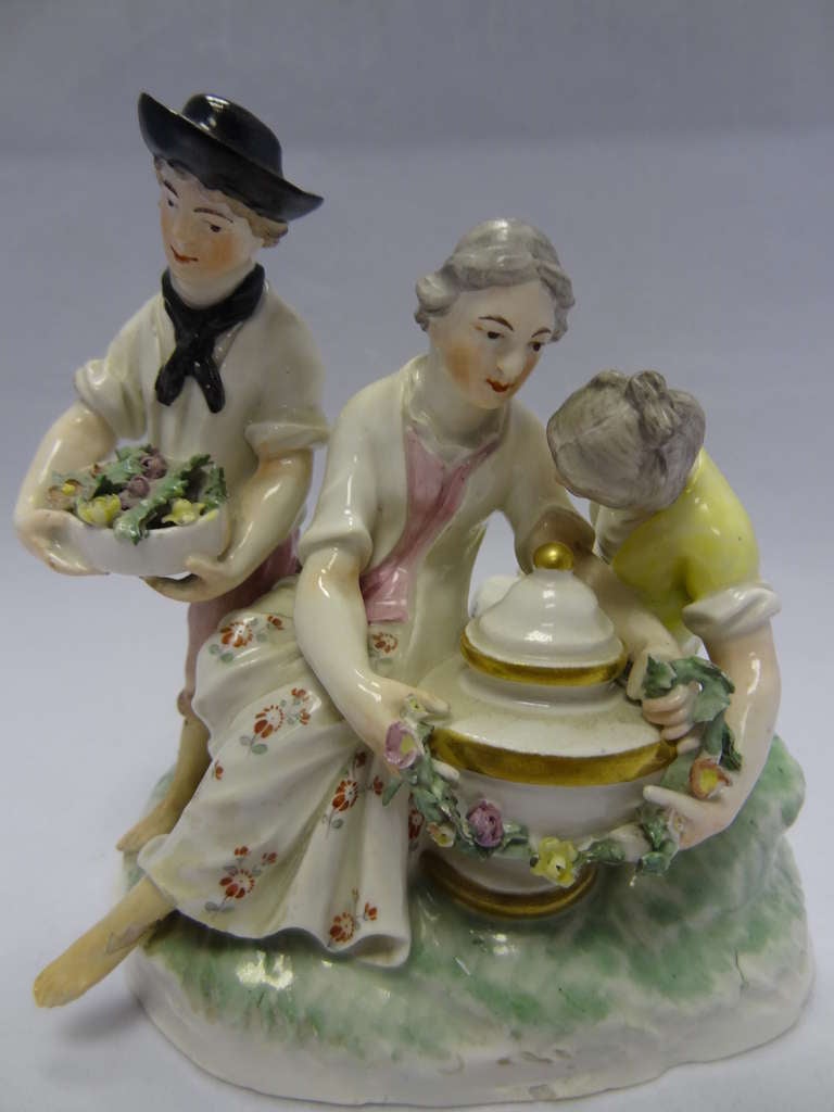 The porcelain manufactory at Frankenthal in the Pfalz region of Germany is considered to be one of the foremost producers of porcelain figures outside of the Meissen factory.
A young man, probably a gardener, carries a box of freshly picked blooms,