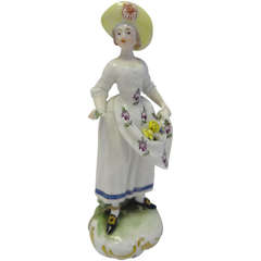 Porcelain Model of a Lady Gathering Blooms by Luecke