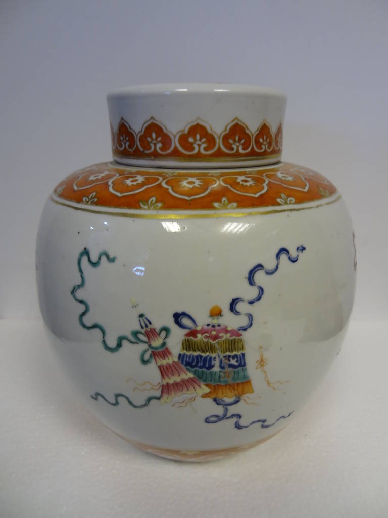 The Ginger Jar with Cover, dating from the very early nineteenth-century and made for the Chinese market rather than as an export piece. The Jar dates from the Jiaqing period (1796 - 1820). Between the orange scroll borders the decoration is in