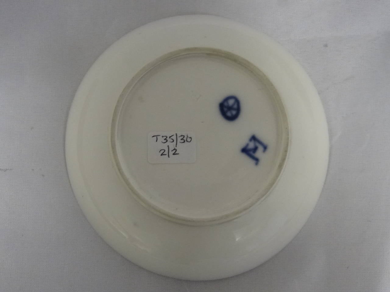 A Höchst Cup and Saucer decorated in underglaze blue.

Cup      h 4.8 cm x d   7.7 cm
Saucer h 2.8 cm x d 11.2 cm

Marked / Inscribed
Höchst 'Wheel' Mark denoting manufacture between 1763 - 1796.

Provenance
Previously sold at Sotheby's