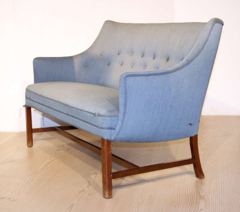 This sofa was made in Denmark by cabinetmaker Frits Henningsen, circa 1930-50. The original blue wool fabric is well worn with minor losses to upholstery as shown in picture. This sofa is 132cm or 52 inches wide.

Reupholstery available on request