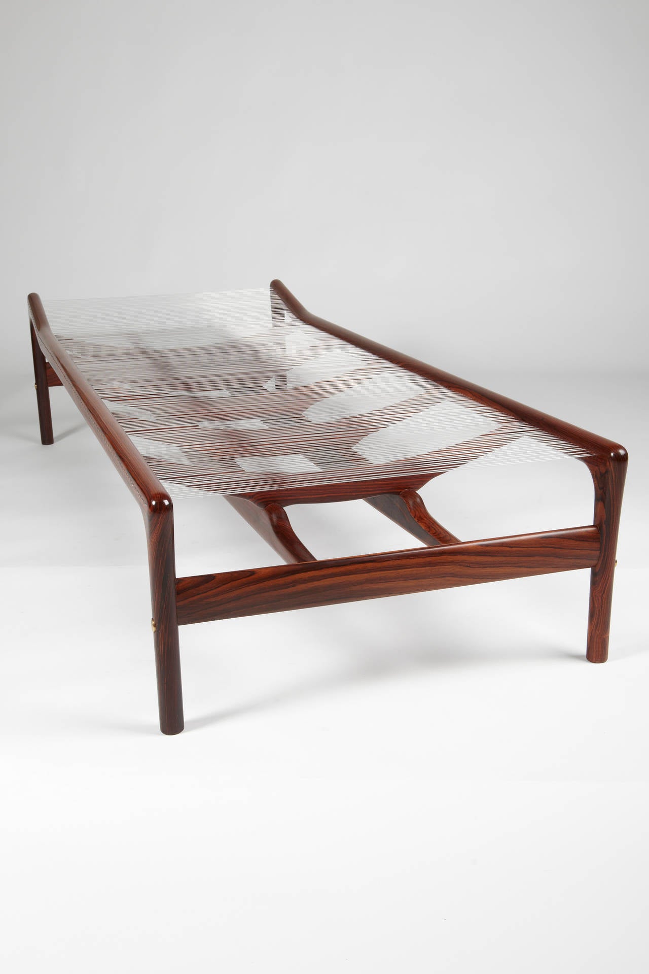 This daybed designed by Helge Vestergaard Jensen in 1955 was made under license by Niels Roth Andersen, the Alderman of the Copenhagen Cabinetmakers' Guild in 2014. In the year before his retirement, Niels Roth Andersen made limited edition of six