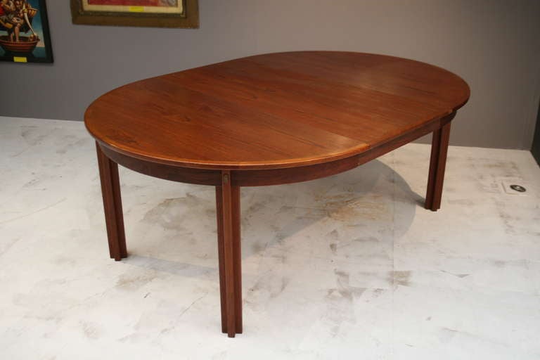 This teak dining table was designed by Borge Mogensen in 1955 and was made by Karl Andersson & Sonner before 1970. Dimensions are H72cm Diameter 130cm. The extension leaf  is 60cm, giving an extended length of 180cm.