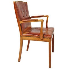 Patinated leather and rosewood armchair from Denmark c1940