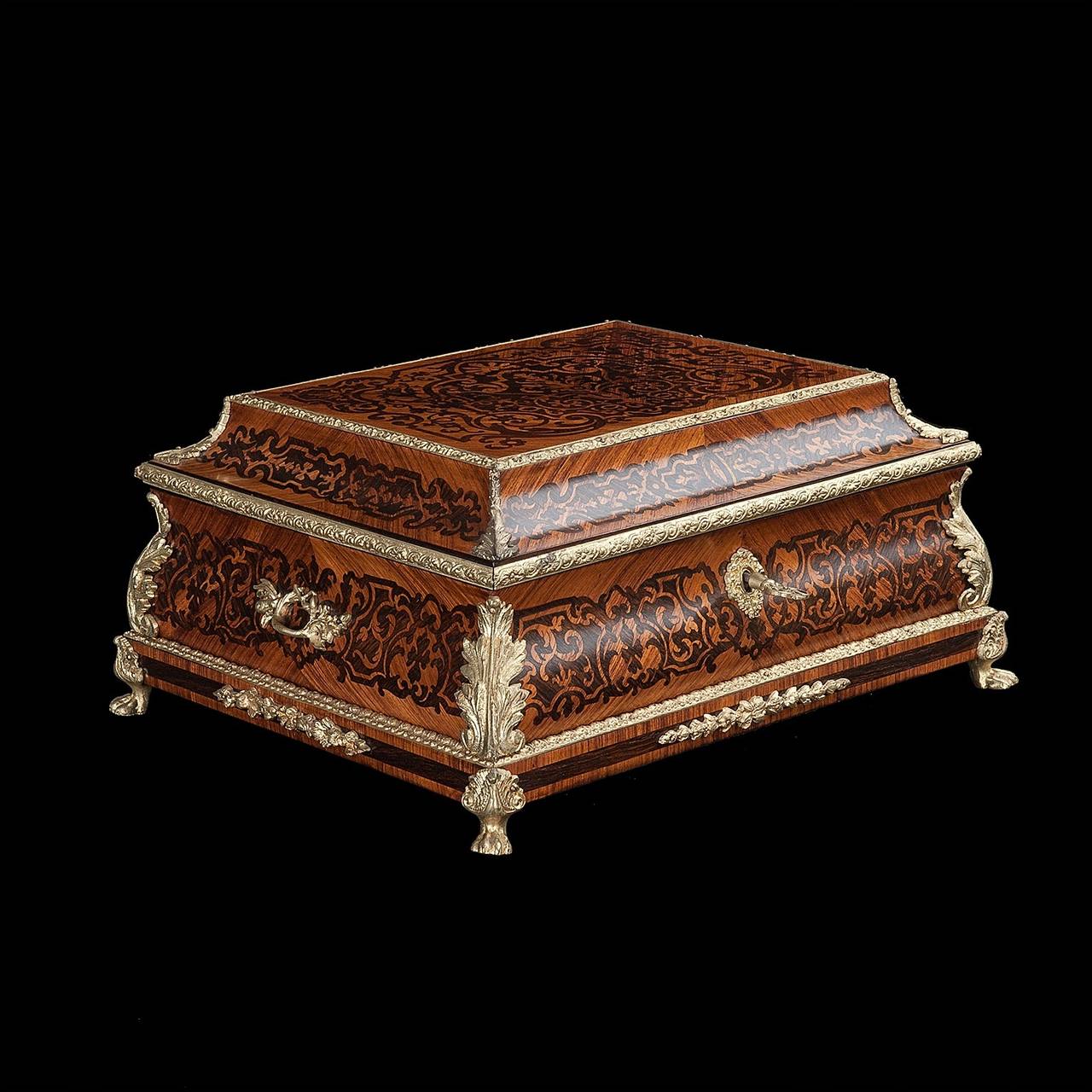 Wooden marquetry jewelry box. Acacia and ebony wood. Richly bronze gilded around all four sides, inside red satin finishing.