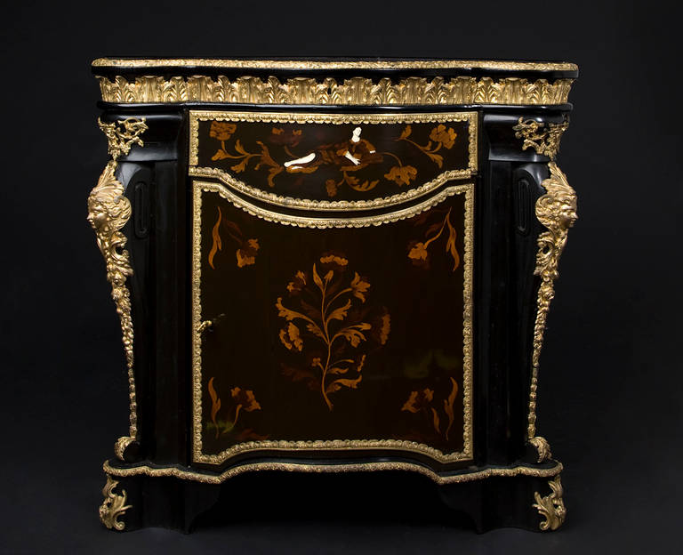 Pair of corner chests. Inlaid top with finer wood ebony, walnut, greenwood and bone (Africa, Americas) front door with marquetry flower still life and on the sides. Bronze gilded ornaments on top, corners and bottom. Inside oak wood shelf. This pair