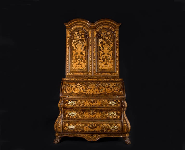 Dutch walnut and fruitwood marquetry Bureau cabinet. Richly filled with three drawers, two doors and one bureau shelf. Inside several small drawers and secret drawers. This Bureau cabinet is an outstanding example of the Dutch invention of