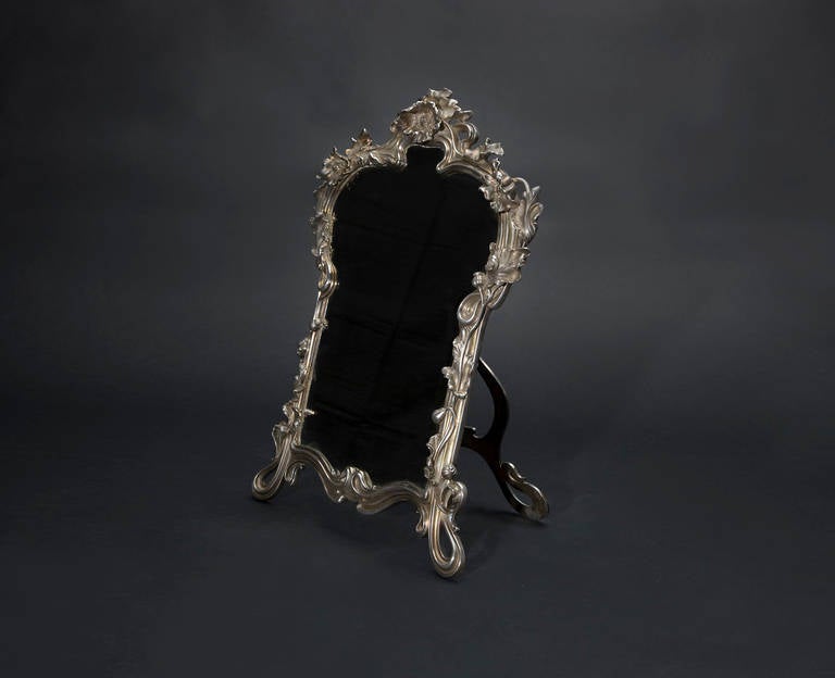 Art Nouveau table mirror. A violin-shaped frame with poppies. Bronze plated (silvered bronze) miroir biseaute.
Victor Saglier was a well-known silversmith working with silver, gold and silver plated, producing in the beginning of the Art Nouveau