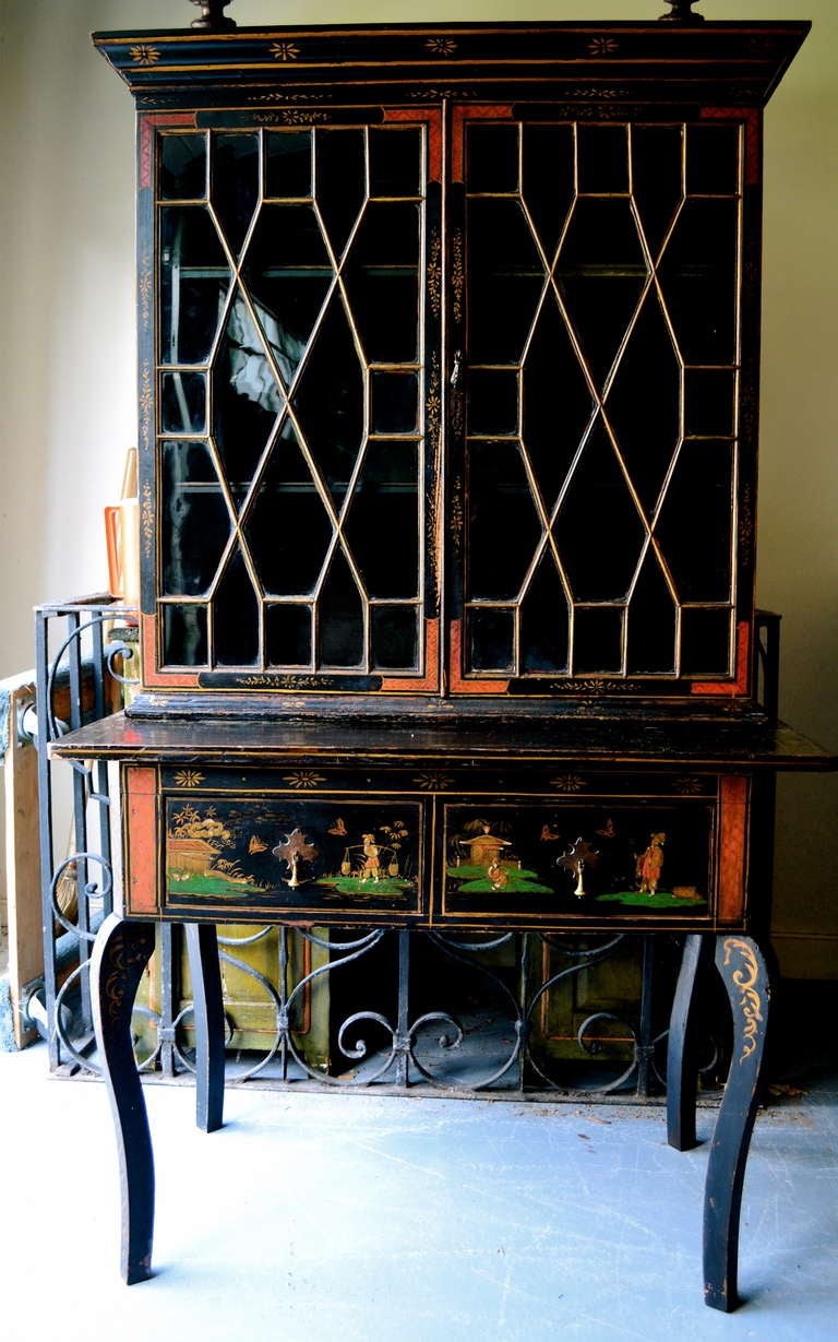 Early 19th Century Japanned Decorated Lacquer Desk with shaped legs, two drawers and glass cabinet doors and shelves.