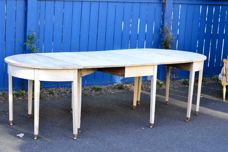 Late 18th Century Swedish Pickled Drop Leaf Table on casters with Demilunes.  Table is 60