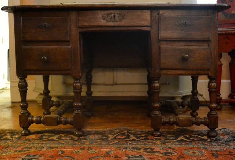 Early 19th Century French Oak Desk with Middle Drawer flanked by Two Drawers