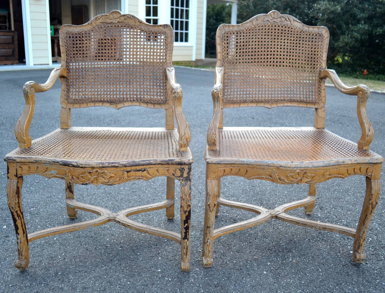 Pair of 18th Century French Regence Painted Caned Armchairs with Stretcher
