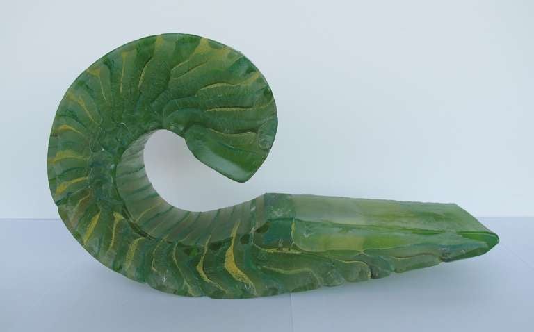 Dorothé van Driel, Glass Sculpture with organic shape like a fossil or a shell. The sculpture, made of various glass layers with molten pigments between them, can be displayed in different ways. The technique Van Driel used to merge glass with