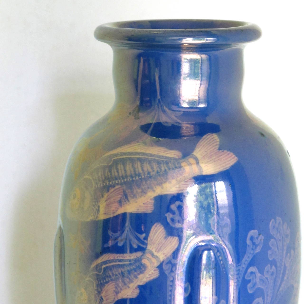Art Nouveau earthenware vase [model number 149] with hand-painted underwater scene below gold luster glaze. Signed on the bottom; "St. Lukas Utrecht," "149" (model number), "F.M." (probably F. Müller).

St. Lukas