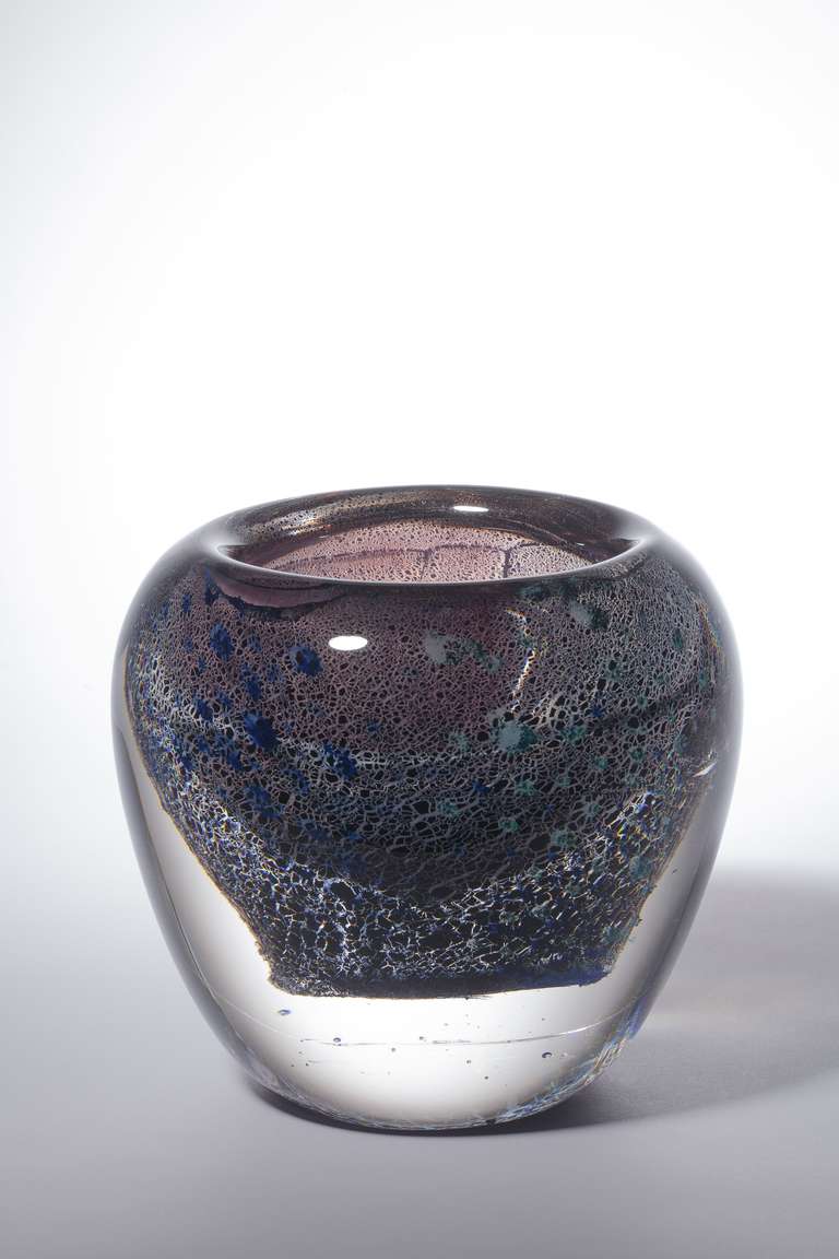 This one-off art glass vase (Leerdam Unica) was designed by Andries Dirk Copier in 1952. This form-in-form vase consists of several layers of glass that show different glass techniques, like tin-antimony crackle and flacks of color. Under a thick