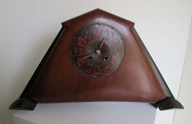 Fons Reggers made this Art Deco clock with wooden case and a decorative clock-face with red digits.