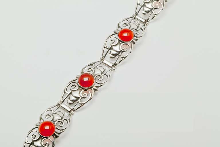 Beautiful silver bracelet with semiprecious stones made in the 1930s by Fons Reggers. 

The firm Gebr. Reggers was founded in 1919 by two brothers Fons and Rein Reggers who came from a long lineage of goldsmiths. They specialized in silver jewelry