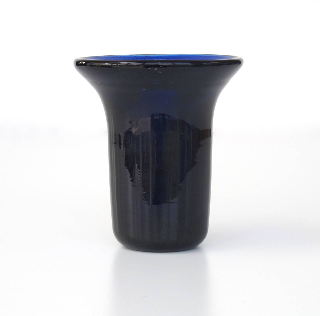 This one-off deep purple and blue colored thick glass vase was made by Chris Lebeau in January 1929 in Bohemia. It is part of the third and last series of glass objects Lebeau made in the Czechoslovakian region. The pieces from this series are