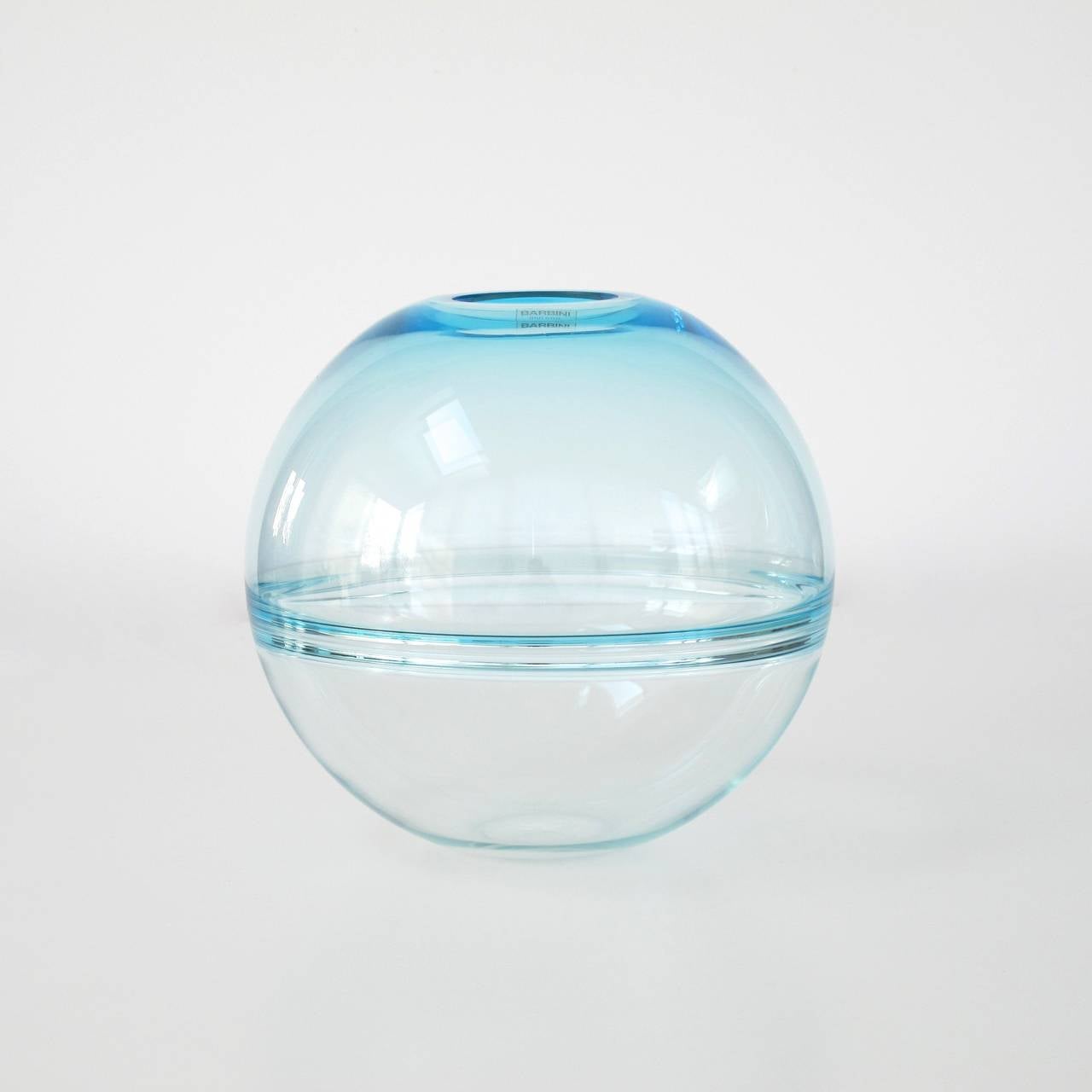 Rare spherical clear glass vase, designed by Alfredo Barbini for Murano. The piece is in an excellent condition and signed twice; Barbini Murano is carved on the bottom and on a sticker on the top rim.
