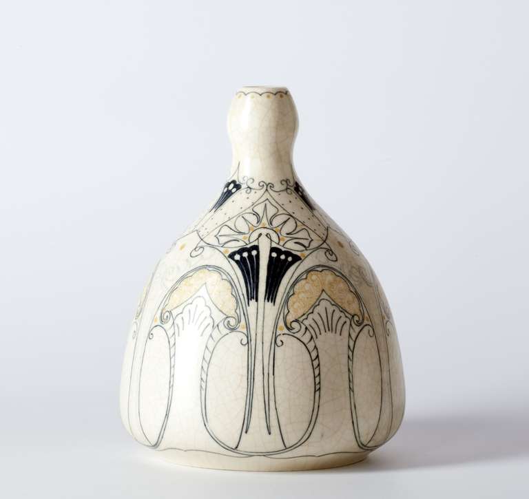 At the beginning of the 20th century the Dutch city of Purmerend became an important centre for Art Nouveau pottery. This vase is an excellent example of Dutch Art Nouveau. The matte white glaze and hand-painted thin linear decoration is typical for