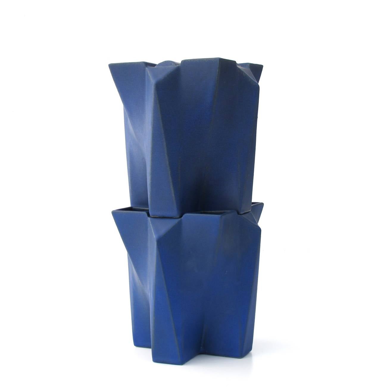 Two geometrically shaped blue glazed stoneware vases by Jan van der Vaart. The vases were designed in order to be stackable and made into a 'Tulip Tower' vase. These pieces of Dutch avant-garde pottery were designed and executed in 1989 in his own