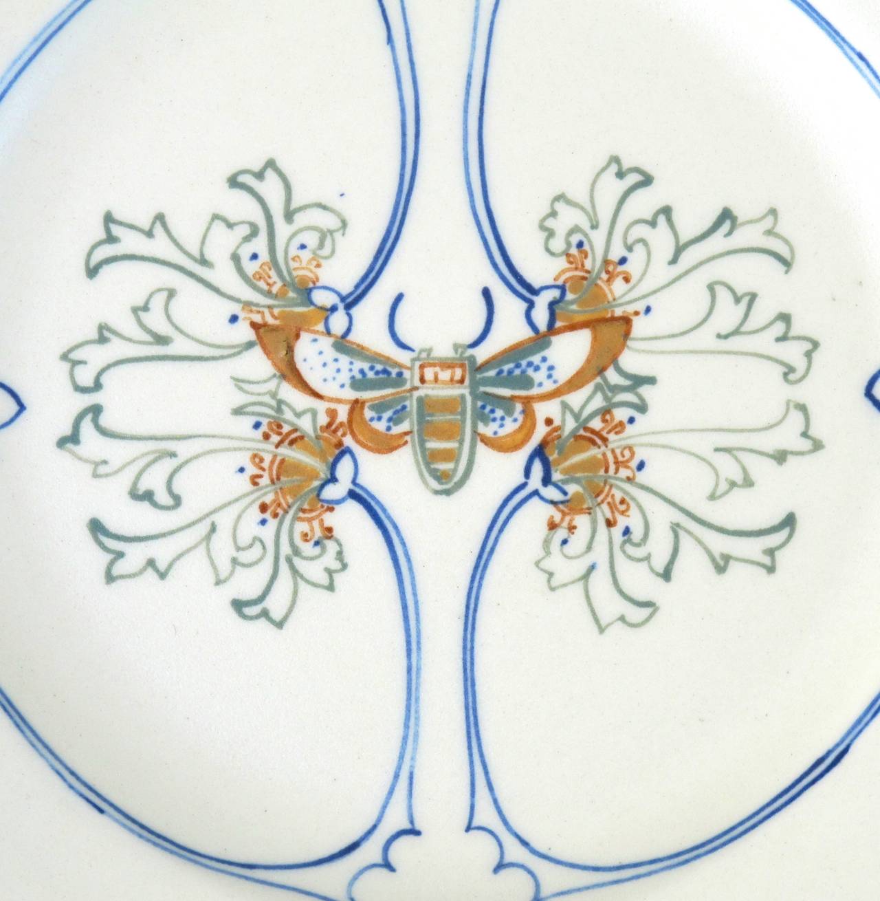 Set of six earthenware side plates with hand-painted polychrome art nouveau butterfly decor, designed by Klaas Vet for the Arnhemsche Fayencefabriek - founded by himself - around 1915. The pieces are in a great condition. 

See also: H. Martens,