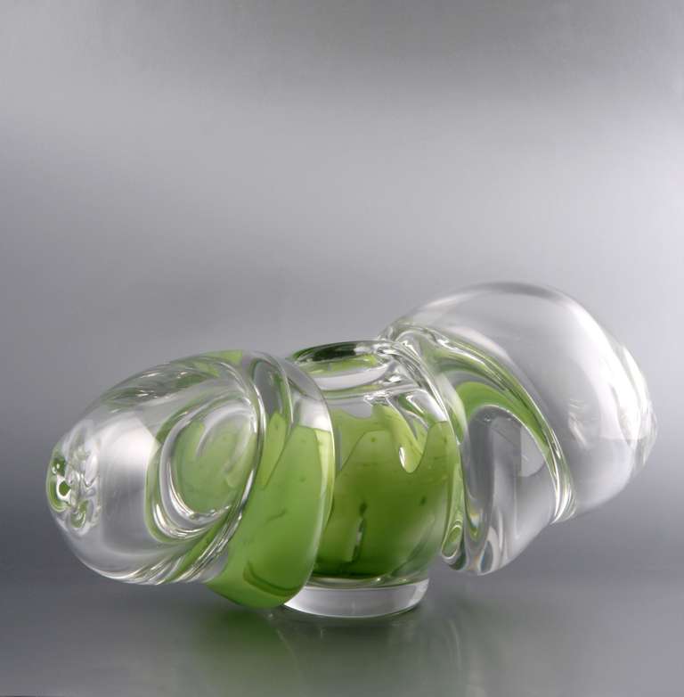 One-off art glass object made of heavy, colorless crystal glass. The mid-section is overlaid with an apple green band. It is signed on the bottom.

Yje Theo Jansen (Amsterdam, 1926) completed his education between 1943 and 1947 at the Leerdam Glass