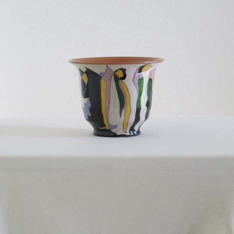Art Deco flower pot designed by Theo Colenbrander for Plateelbakkerij RAM (RAM pottery in Arnhem, The Netherlands). The pattern called OPGAAND (Rising) was handpainted on the earthenware vase by painter Gerrit Baas. It was manufactured in 1924 and