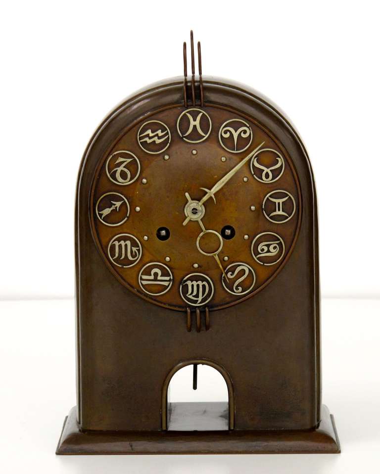 Beautiful pendulum with signs of the zodiac in Amsterdamse School style. It is attributed to Winkelman & Van der Bijl from Amsterdam.

Winkelman & Van der Bijl was known as a workshop for ironwork.  H. J. Winkelman started it around 1909 when he