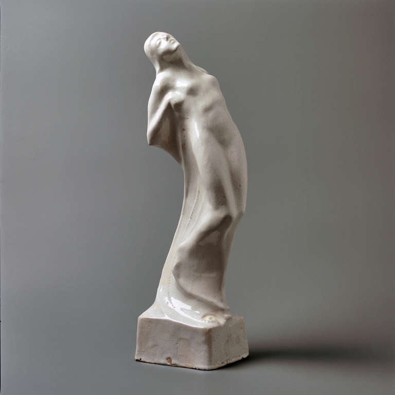 Beautiful organic female figure with mysterious symbolic facial expression by Cris Agterberg. The sculpture is 51 cm high. The dimensions of the basement are 13 x 10,5. The object is signed Cris Agterberg (incised). The object has typically slender