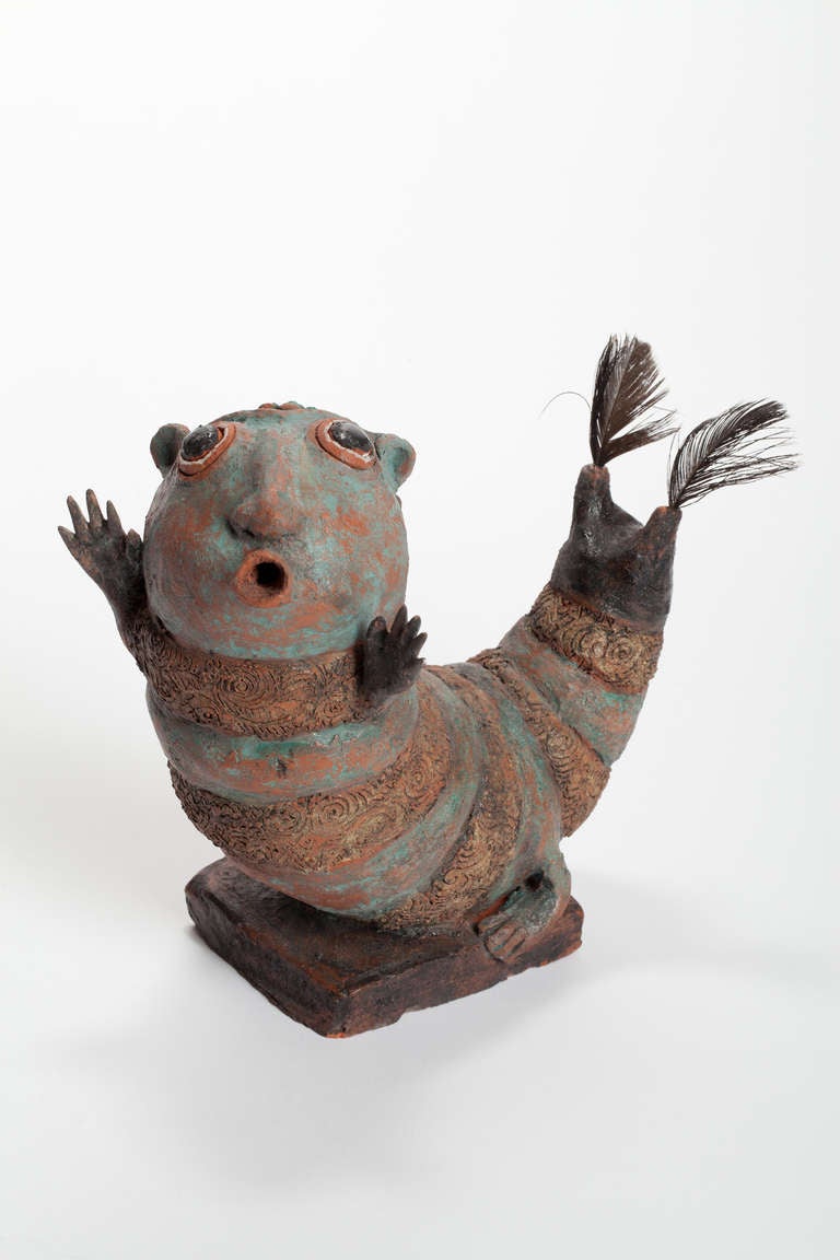 This marvelous ceramic figure by Etie van Rees represents a singing caterpillar and was made in the 1950s. The object is signed with the artist's monogram EvR at the bottom. 

Etie van Rees (1890-1973) was a painter and started as ceramic artist