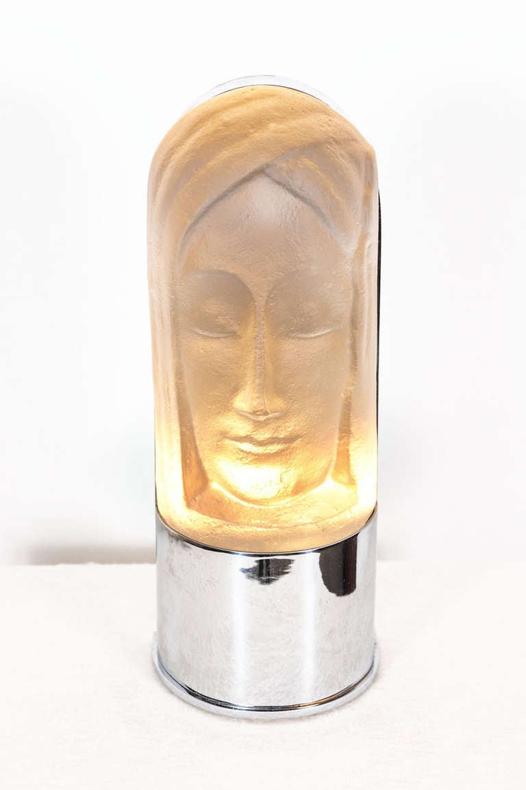 Wonderful, mystical Art Deco wall lamp. The glass object represents a mask of a woman. It was designed by Dutch artist C.C. van Asch van Wijck for Leerdam Glassworks in 1929. The matching pedestal was fit to the glass object in the 1930s. Dimensions