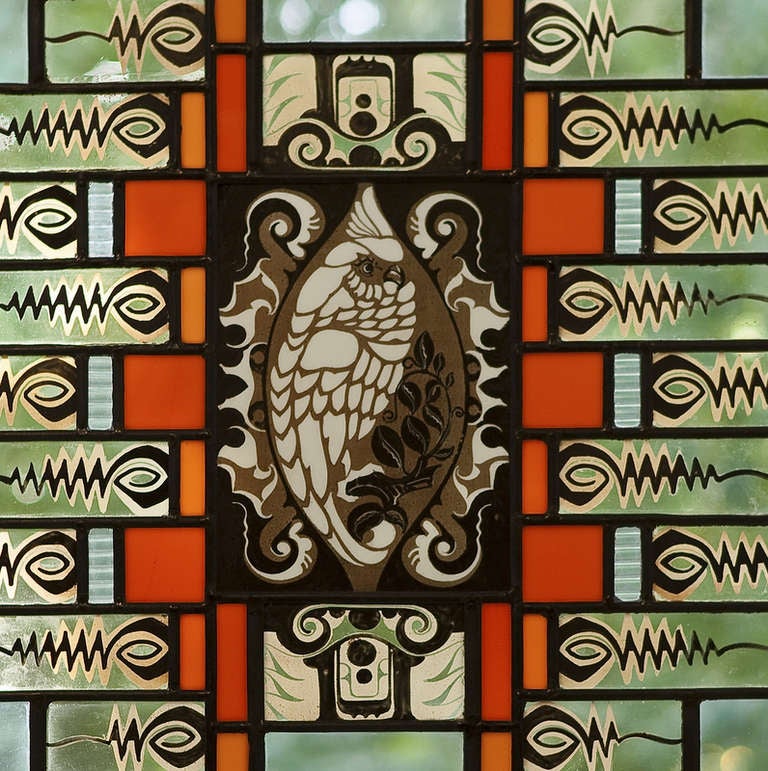 Outstanding stained glass window in black poplar wood frame with image of a cockatoo made in the 1920s. The window is attributed to Willem Bogtman (1882-1955), art teacher, designer and stained glass manufacturer. In 1912 he started a workshop for