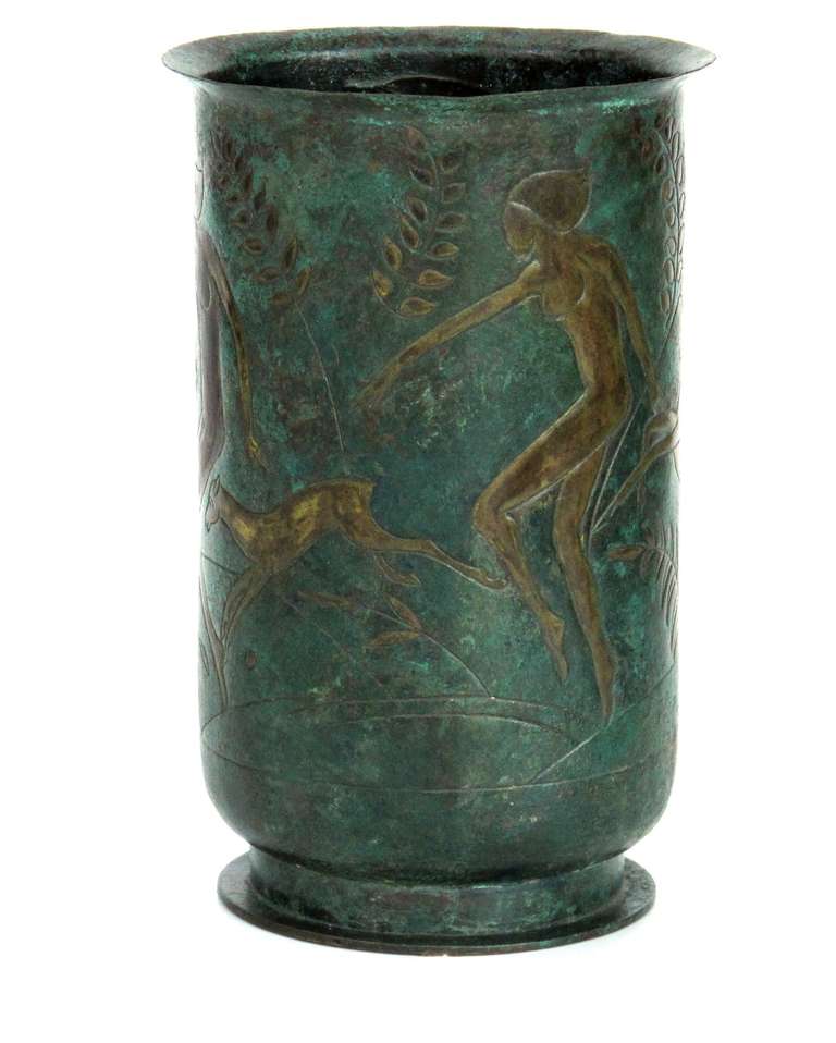 Cris Agterberg, Copper vase with playful decoration in Art Deco style depicting nude women and deers, 1940. Unicum, manufactured in his studio by the artist himself. 

Agterberg's unique works are very popular among collectors because of the high