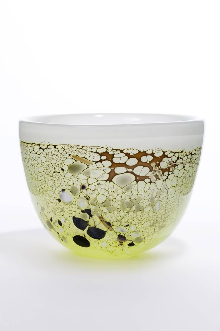 Thick opalescent art glass vase with nature inspired décor in green, brown and yellow tones. 'Waterside' is the theme of this unique vase that the Dutch glass artist Willem Heesen made in his studio 'Oude Horn' in 1984. The playful round shapes do