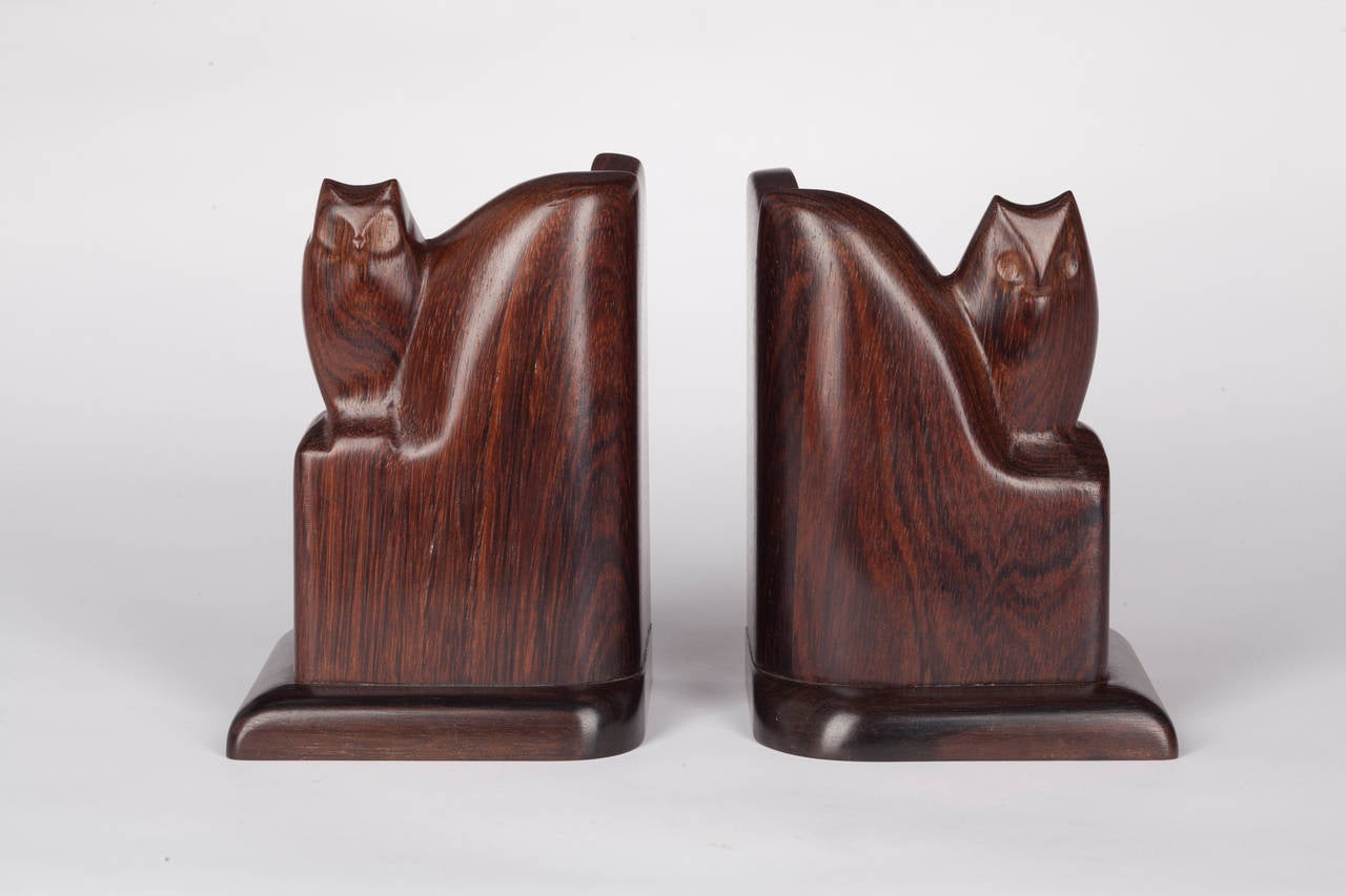 A pair of two Art Deco bookends with sculpted owls from the 1920s by Bernard Richters. The bookends are carved out of rare coromandel wood (rosewood) and differ in height and expression, which gives the pair a unique appearance. Richters was a
