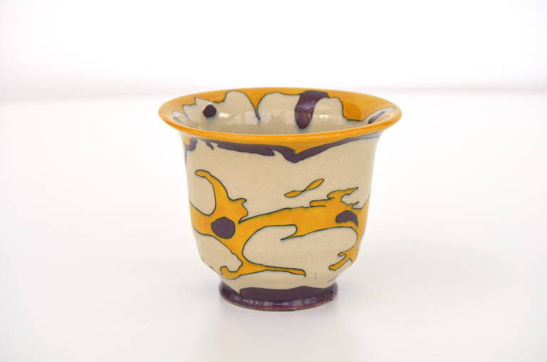 Art Deco flower pot designed by Theo Colenbrander for Plateelbakkerij Ram (Ram pottery in Arnhem, The Netherlands). The pattern called Drijvend (floting) was hand-painted on the earthenware vase by painter Willem Elstrodt. It was manufactured in