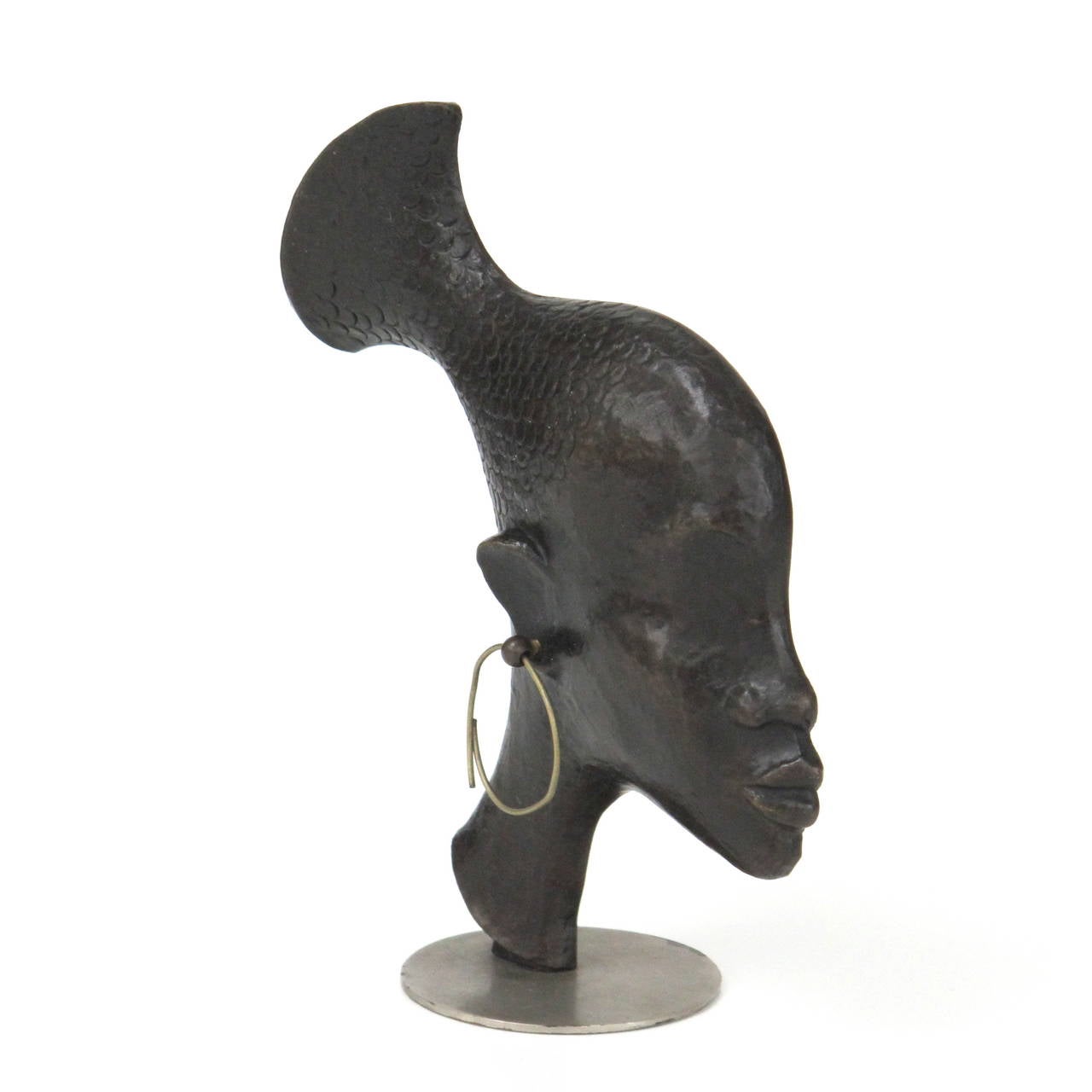 Beautiful bronze head of an African Woman flowing into a fish tail. Made by (Werkstatten) Karl Hagenauer, Vienna. Stamped with a monogram HH.