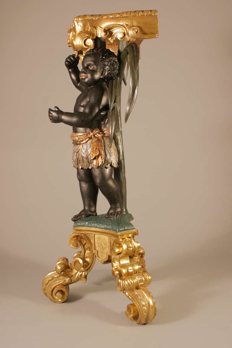 Italy, circa 1850

A beautiful richly carved  polychrome and gilt, wood pedestal, representing a blackamoor, under a natural colored palm tree.
very lovely model, fully restored.
The Empress Eugénie had a little african page, always with her at