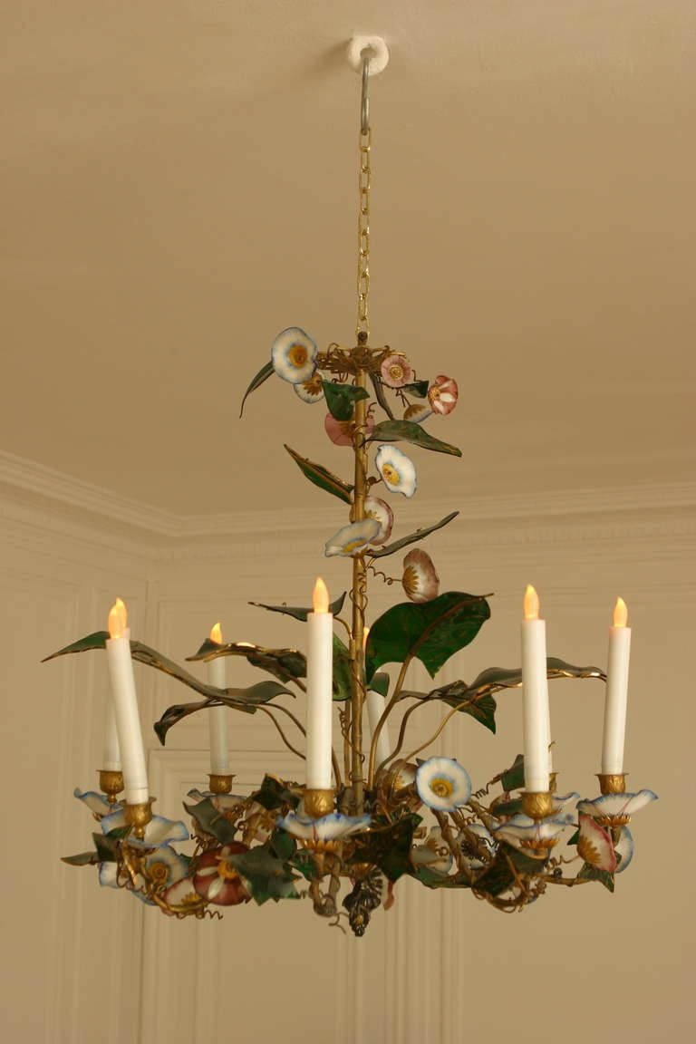 France, mid 19th c.,

A Rare and poetic eight lights gilt bronze, bindweed chandelier .
Brass, gilded metal, adorned with flowers and leaves in natural colours, made of painted glass and porcelain flowers.
Not electrified.

Rare et poétique,