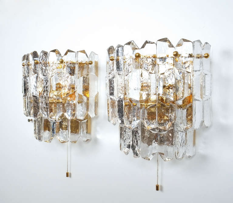 Gorgeous pair of large gold plated textured glass sconces by J.T Kalmar in excellent condition.  Each light holds three bulbs.