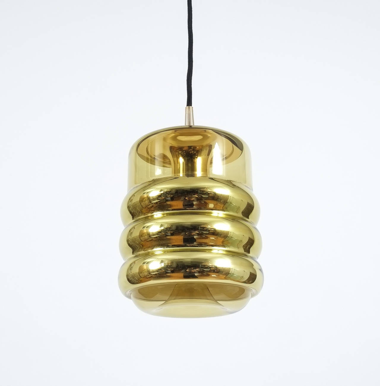 Nice set of three identical glass pendants by Staff or Germany featuring slightly yellowish glass with a golden metallized mirror effect. Each light takes up to 75W. The cord wire can be adjusted in length according to your requirements.