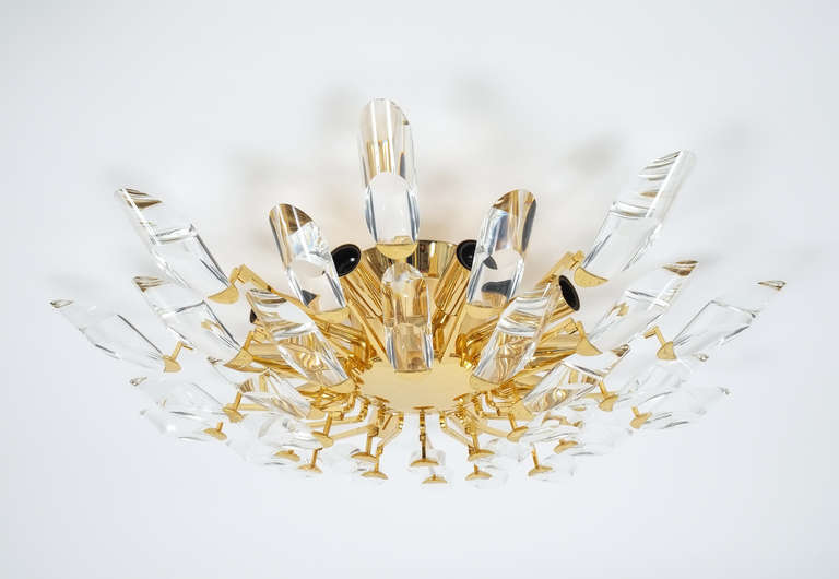 Gorgeous set of 3 identical italian crystal flush mounts.(24 inches in diameter) Gold plated brass branches and unique geometrical crystals. This fixture holds up to 10 bulbs and is in excellent condition (it has been professionally cleaned and