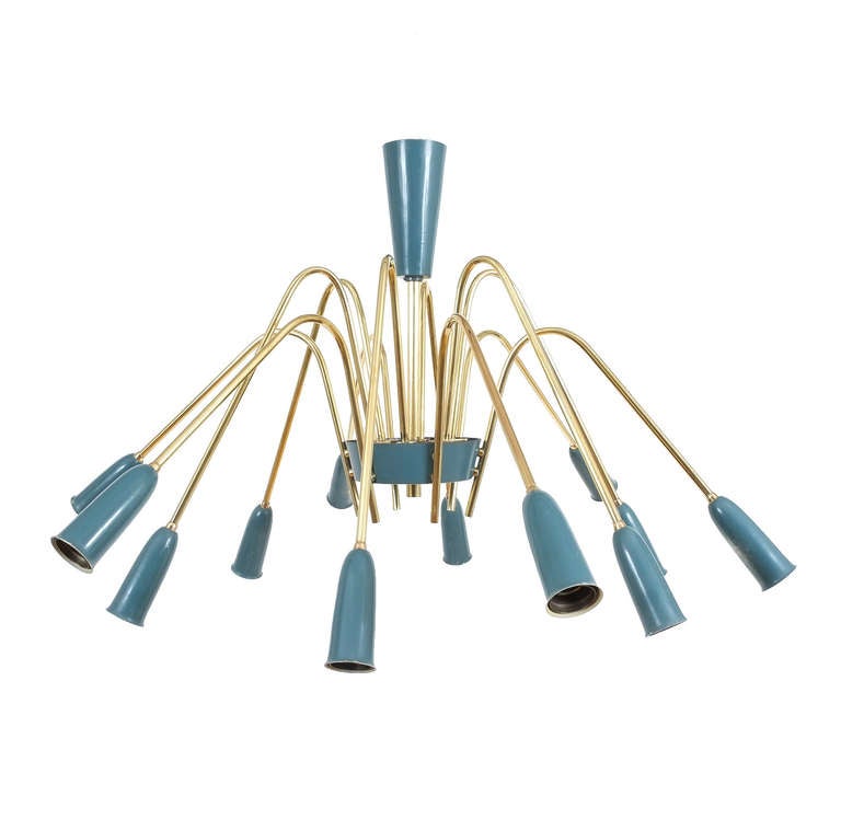 Beautiful 38 inch chandelier featuring 12 shiny alternating brass arms and bulbs. The bulb tubes have a light blue color. The light has been refurbished/polished and newly rewired. The heights can be adjusted.