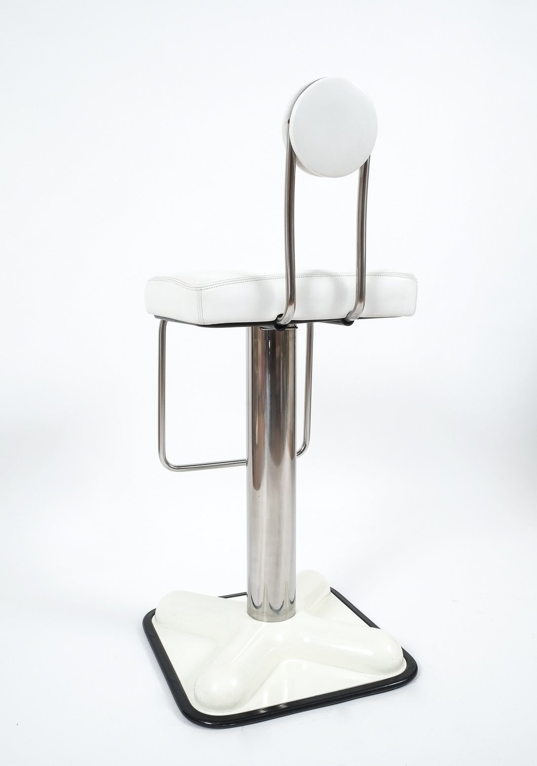 Set of three swivel bar stools designed by Joe Colombo 'Birillo' for Zanotta, 1971. Beautiful set with white leather and chrome hardware on a heavy white plastic/steel foot. The original leather is well preserved, all stools are in working and very