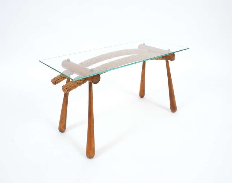 Elegant petite coffee or side table designed by austrian architect Max Kment.
Comprised of beechwood, cord and glass, this table was greatly inspired by the japanese samurai sword culture.
The condition is very good, the glass top has been newly