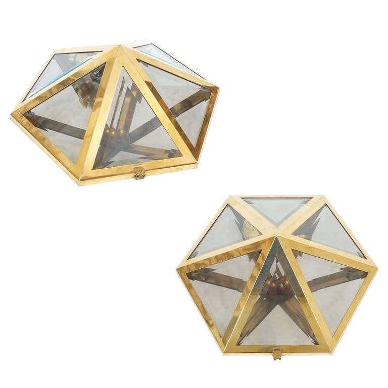Josef Hoffmann Set of 9 Brass and Glass Pyramid Flush Mounts Wall Lamp, 1900

Originally designed in 1903, this light was probably manufactured in the 1970s and consists of brass and crystal cut beveled glass. The condition is excellent, refurbished